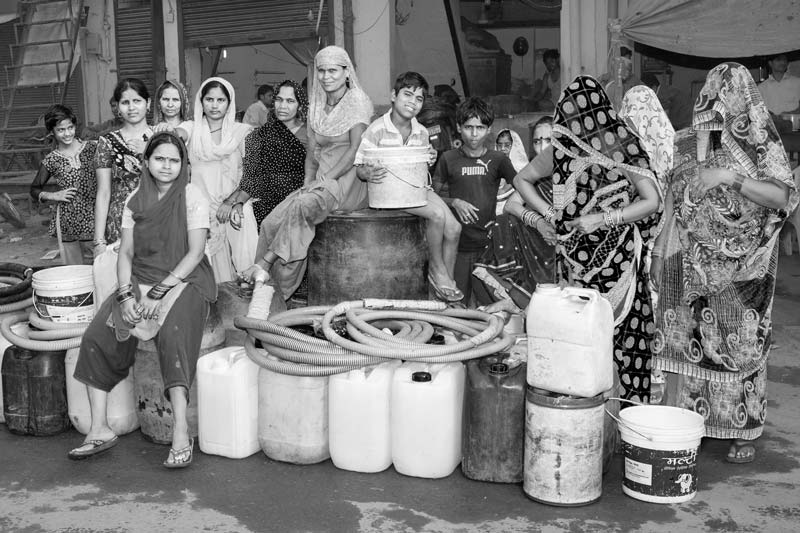 Human Right to Water in Delhi - Women and children in an unauthorized colony in Delhi waiting endlessly for the Delhi Jal Board water tanker to arrive